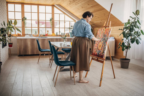 istock Female painter painting in her studio 1251738383