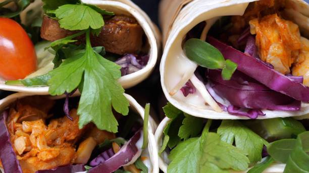 istock Vegan Wraps With Jackfruit, Greens And Vegetables. Close-Up 1251738793