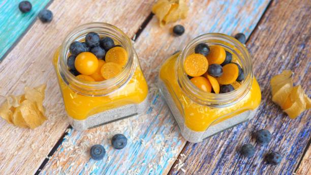 Chia Seed Vegan Pudding With Mango, Physalis And Blueberry