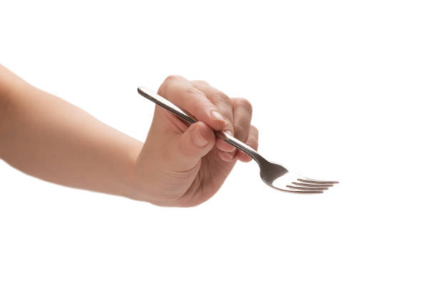 istock Fork in woman hand isolated on white. 1251742141