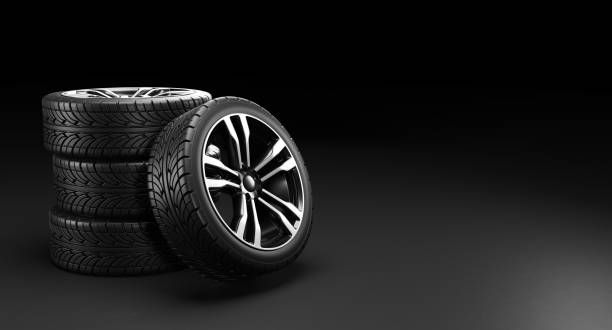 istock Four car wheels on black background. 3D rendering illustration. 1251743037