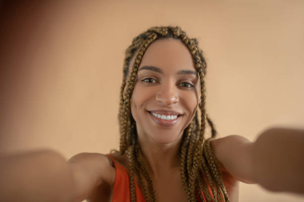 istock Smiling young African American female making selfie 1251743561
