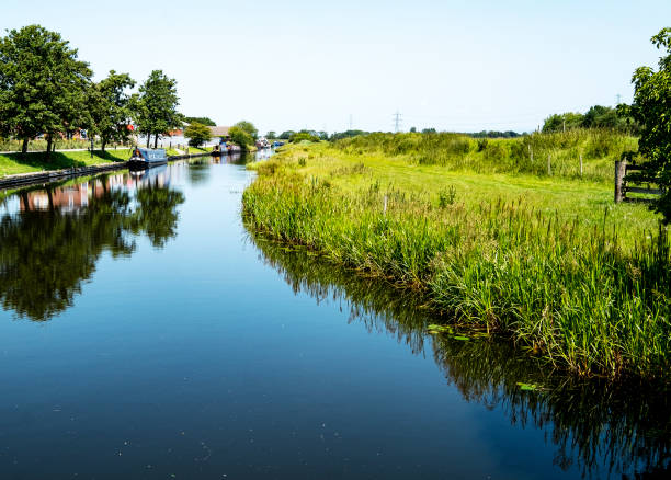 Barges and narrow boats moored at canalside