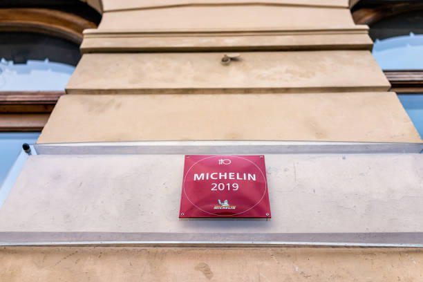 Warsaw capital city with sign closeup for Michelin star at Elixir restaurant by Dom Wodki Warsaw, Poland - December 25, 2019: Old town historical capital city with sign closeup for Michelin star at Elixir restaurant by Dom Wodki book title stock pictures, royalty-free photos & images