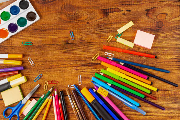 istock composition with notebook blank page colorful pencil, marker and pen mock-up Back to school concept 1251761383