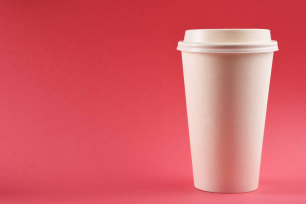 istock A paper coffee cup on pink background 1251761963