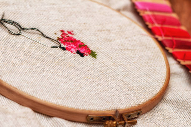 istock Cross stitching embroidery process. Needle embroidery frame threads. Hobby DIY lifestyle. 1251763663