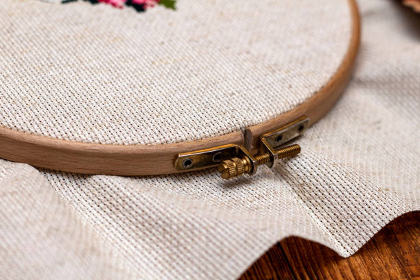 istock Cross stitching embroidery process. Needle embroidery frame threads. Hobby DIY lifestyle. 1251763666