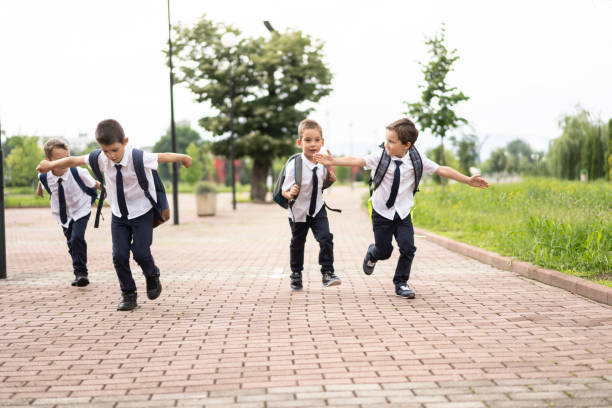 istock Little boy running to school 1251767456