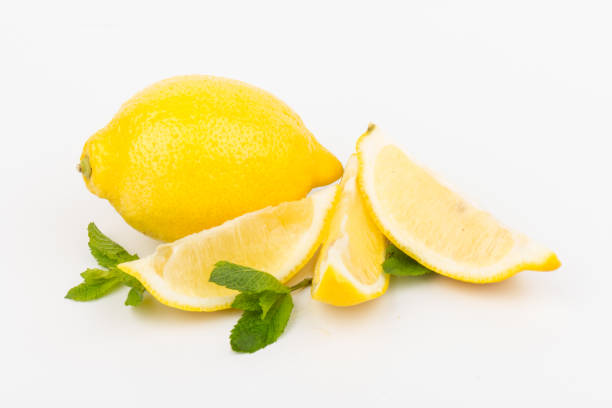 istock Group of lemons with mint leaves, isolated on white background 1251767763