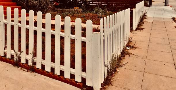 istock picket fence and a sidewalk - diminishing perspective 1251768659