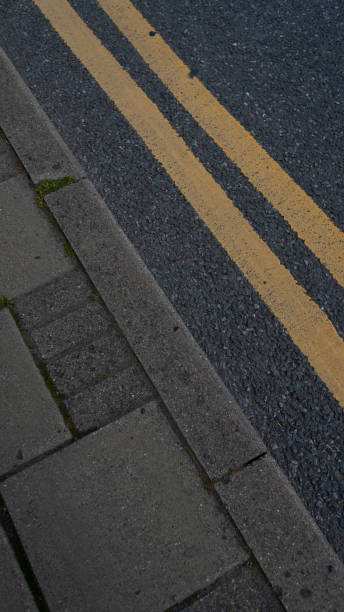 istock abstract road shot double yellow line 1251772175