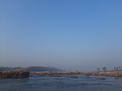 Beautiful view of the flowing river water. Barakar river karamdaha Ghat, border of Dhanbad Jamtara.This photo is of a cold morning. It is the second largest river and cleanest in Jharkhand India. Its length is 225 km (140 mil).Beautiful Scene.