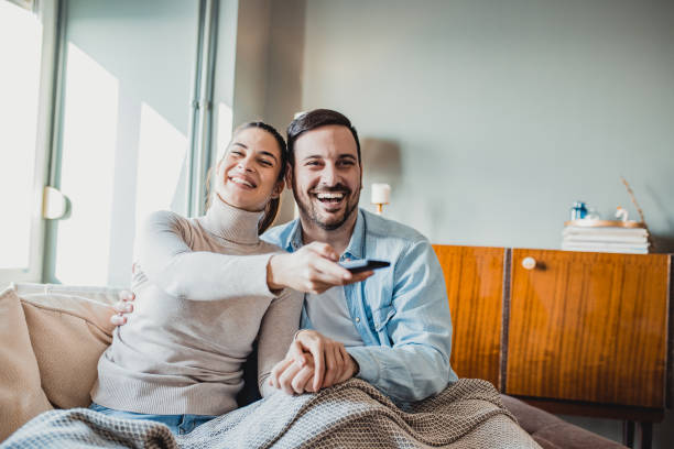 istock Young couple watching TV 1251791648