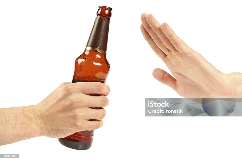 Say no against drinking irresponsible hand reject a bottle of beer. isolated on white background Giving Stock Photo