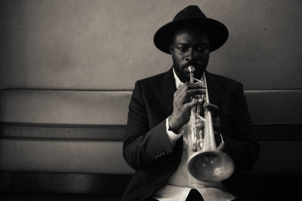 The trumpet player Trumpet, playing, vintage, dark, art, jazz, trumpet player, close-up, music, Bar, passion, alone, black culture photos stock pictures, royalty-free photos & images
