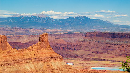 Grand view of Marlboro Point overlook and potash ponds in Canyonlands National Park and La Sal Mountain on the background.
