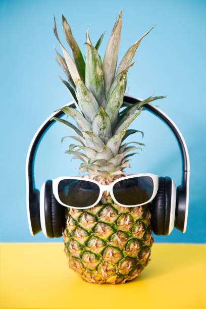 istock Pineapple with headphones and sunglasses 1251807159