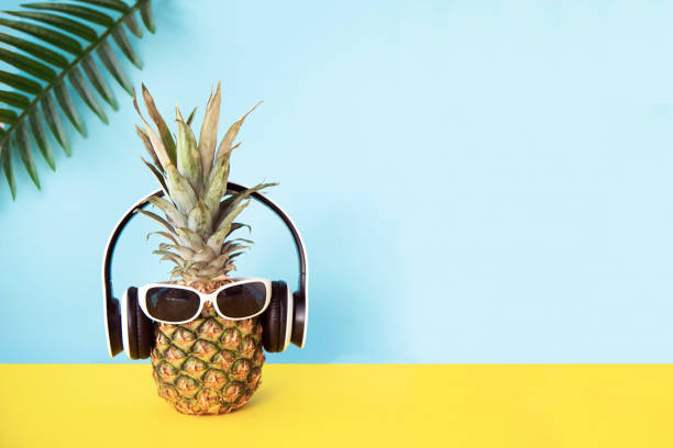 Pineapple with headphones and sunglasses