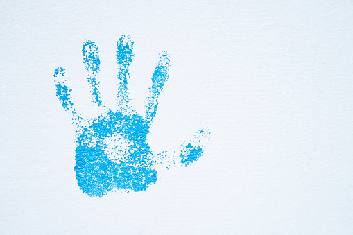 Blue  hand print on wall
