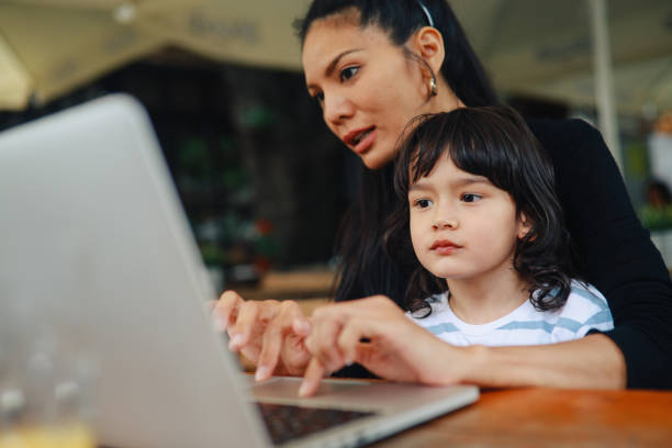 istock Mother finishing freelance work while spending time with kid 1251845852