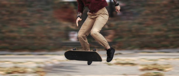 istock Young female skateboarder 1251857335