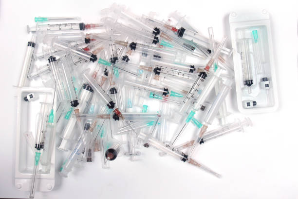 istock Pile of used syringes with needles 1251858510