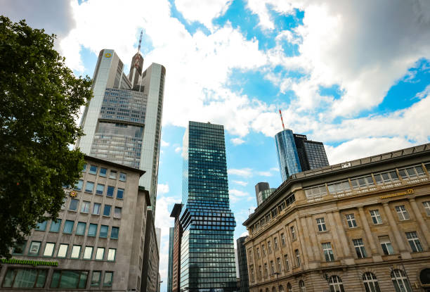 Frankfurt am Main, Germany - June 20, 2020: Commerzbank tower, Omniturm and Maintower skyscrapers as seen from Goetheplatz in Frankfurt, Germany.