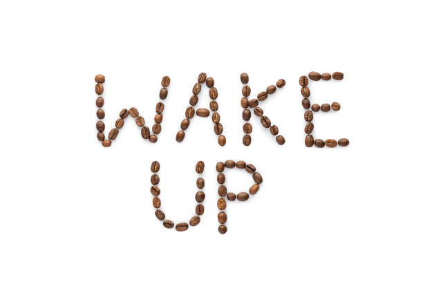 istock Wake up phrase made from roasted coffee beans isolated on white background 1251878964