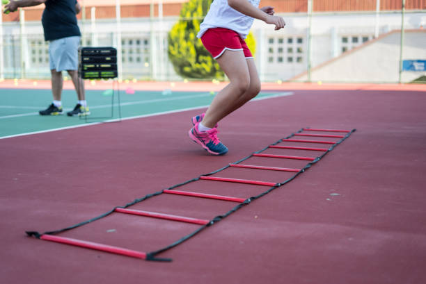 istock a girl is doing leg exercise on the hardcourt 1251899454