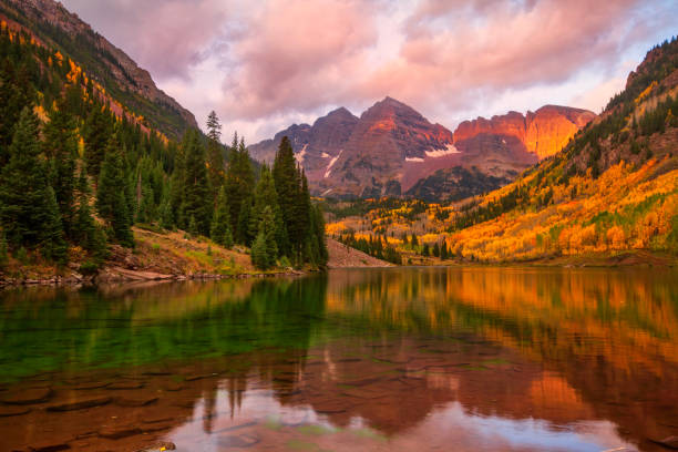 Classic Maroon Bells Fall landscape scene Sunrise on Maroon Bells, located outside of Aspen, Colorado on a fall morning fall scenery stock pictures, royalty-free photos & images