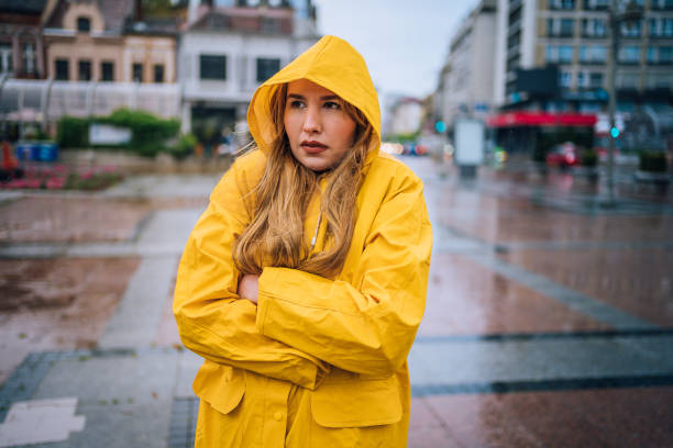 istock Woman standing in the rain and freezing 1251900491