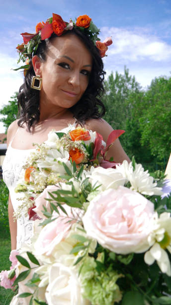 istock Smiling bride with a flower wreath on her head. 1251901602