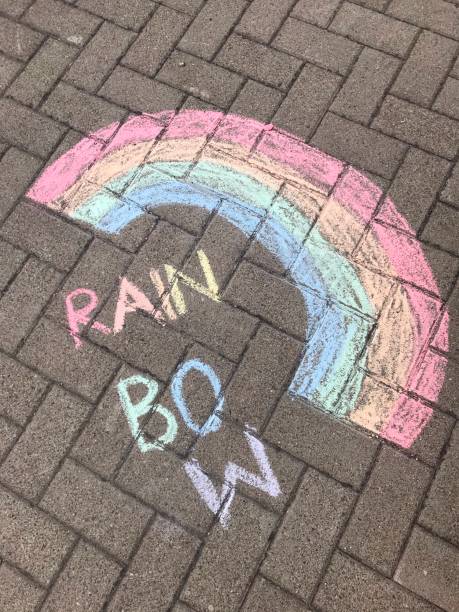 istock rainbow painted with chalk on a street 1251901621