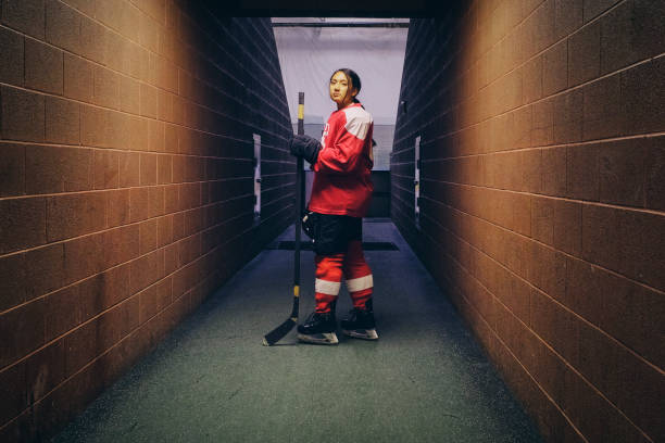 istock Woman Hockey Player 1251903805