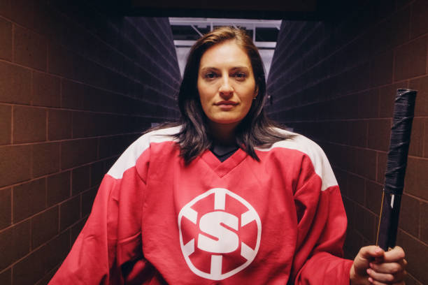 istock Woman Hockey Player 1251904371