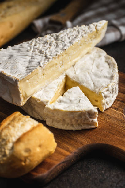istock Brie cheese. White soft cheese with white mould. 1251922451