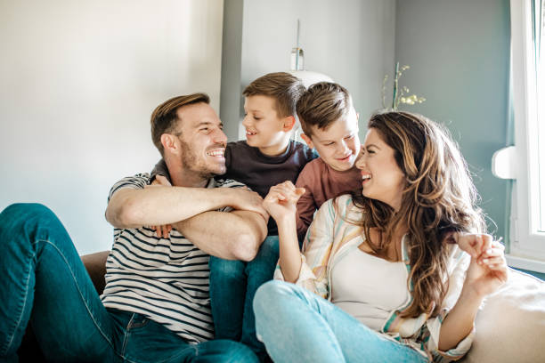 istock Happy young family with two sons 1251931653