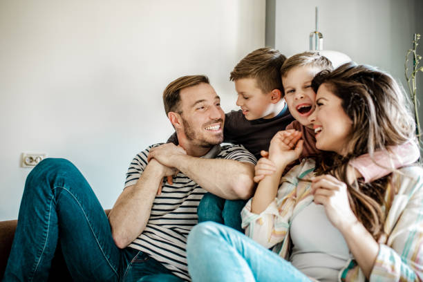 istock Happy young family with two sons 1251932203