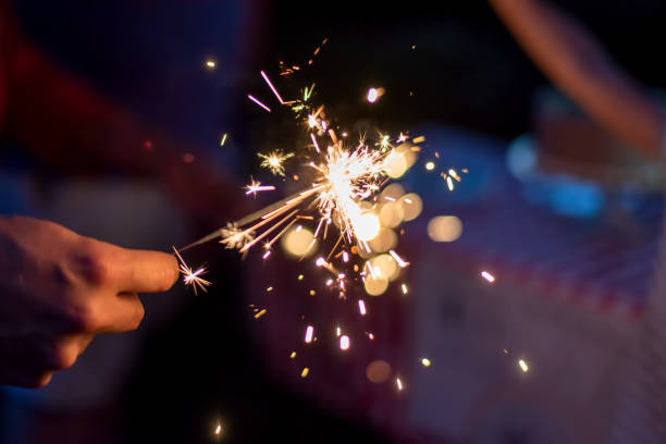 istock Lighting sparklers in the backyard on a summer evening 1251949788