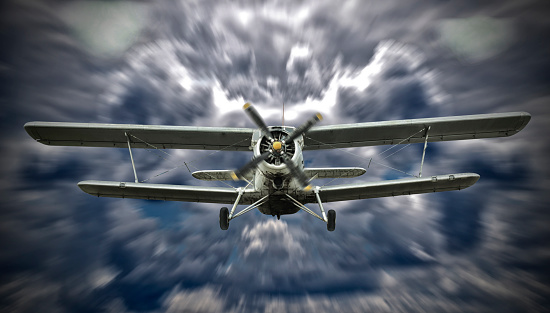 Old retro biplane flying in the blue cloudy sky - 3D render