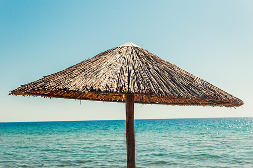 Straw umbrella on the beach