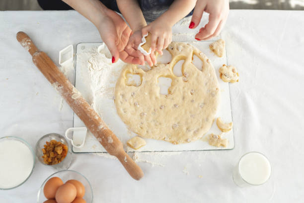 istock child makes cookies from dough on the table on a white background 1251957200