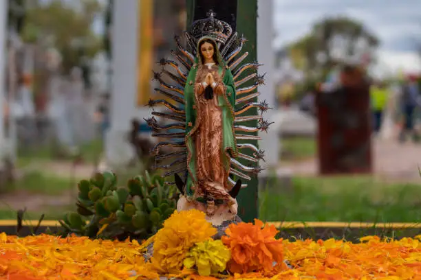 Photo of Figure of the Guadalupe Virgen  at a Mexican cemetery