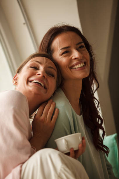 istock Two female friends having a laugh while hanging out 1251959415