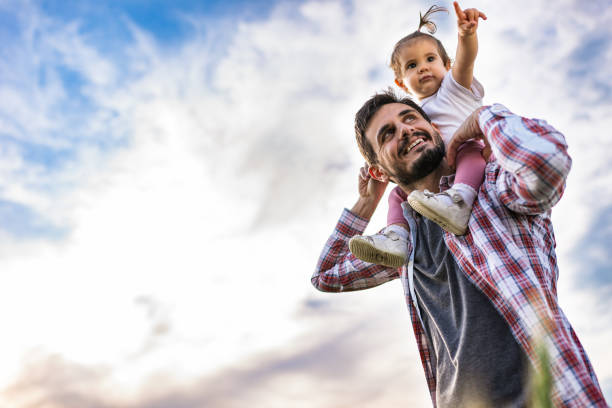 istock Father and daughter exploring nature together 1251961756