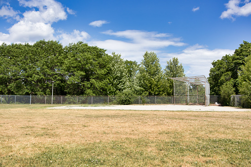 An old baseball diamond in a public park.