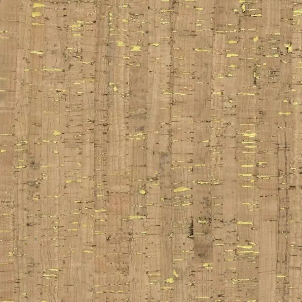 Photo of Natural cork fabric texture with metallic gold shimmer dots