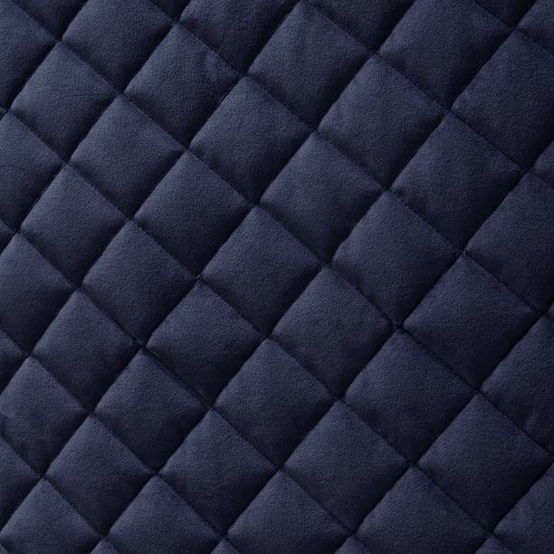 istock Navy velvet diamond quilted bedspread fabric texture 1251976134
