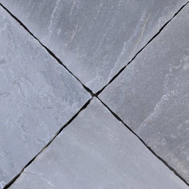 istock Paving slabs texture in blue-grey color with riven texture 1251976221